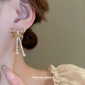 Gold Tone Bow Stud Earrings With Pearl Chain Tassels view 2