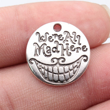 We Are All Mad Here Grinning Face Round Metal Pendant