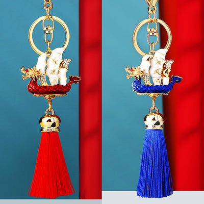 Main image 1 shows a supplied presentation of sailing ship tassel keychains with visible attached key hardware.