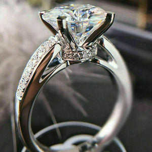 Four-Prong Round Clear Solitaire Ring With Slim Pave Band
