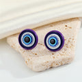 Round Blue Evil Eye Stud Earrings with Six Colored Metal Rims view 8