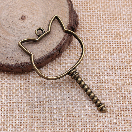 Angled display of the cat head open frame charm