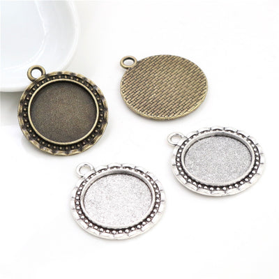 Beaded Border Oval Cabochon Pendant Bases in Two Finishes shown in a grouped front view