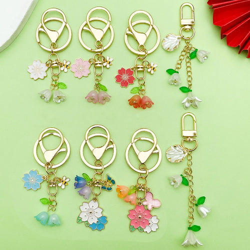 Image 1 showing a bunch of flowers with charms on them.