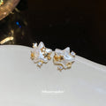White Flower Star Stud Earrings with Crystal Gold Tone Details view 4