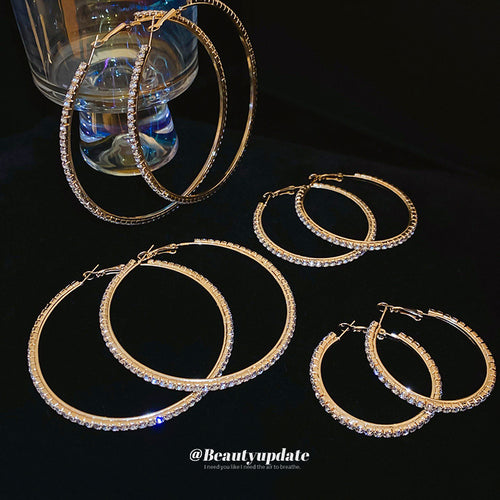 oversized crystal hoop earrings displayed from a second angle