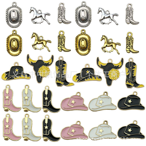 Gold-tone assorted shape charms arranged on a light background