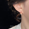 Rose Gold Mini Huggie Hoop Peach Blossom Flower Pair view 2
