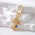 Gold and Silver Tone Crystal Hamsa Hand Evil Eye Clip Keychains in Ten Designs view 12