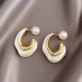 Gold Tone Curved Stud Earrings With Pearl Accent Backs view 2