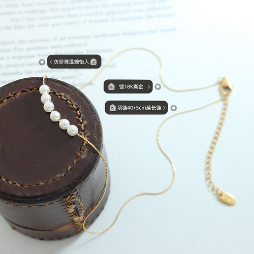 Gold five pearl necklace on leather cuff with plating and length labels
