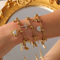 Charm Bracelets Cross Ocean Celestial Gold Steel Titanium view 1