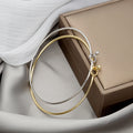 Gold Silver Slim Knot Bangle Bracelet Ball End Closure view 1