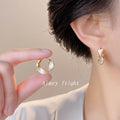 Gold And Silver Tone Twisted Two Color Chunky Huggie Earrings view 2