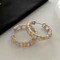 Clear Faceted Stone Crossover Huggie Hoop Earrings view 6