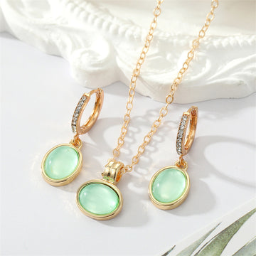 Gold Tone Pale Green Oval Stone Necklace and Huggie Earrings