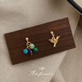 Gold Asymmetric Bird Stud Earrings Multicolor Stone Pair view 1