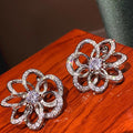 Silver-Tone Open Flower Stud Earrings with Clear Stone Details view 5