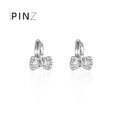 Pavé CZ Bow Huggie Hoop Earrings Gold and Silver Tones view 1