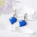 Silver Tone Puffy Heart Evil Eye Huggie Earrings in Five Colors view 3