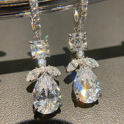 Silver pear drop huggies close-up showing square and leaf stones