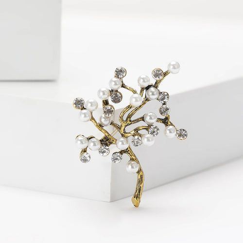 Close-up product view showing the colors and surface details of the pearl branch tree brooch