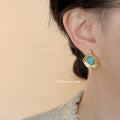 Gold Tone Hammered Leaf Stud Earrings Turquoise Cabochon view 2