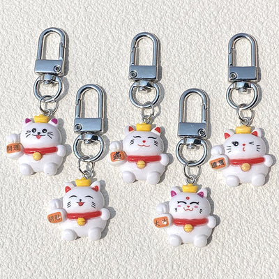 Main product view of white Fortune Cat Resin Clip Keychains in Five Designs