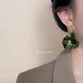 Gold Tone Hammered Square Top And Dark Green Flower Drop Earrings view 2