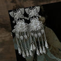 Silver Butterfly Floral Tassel Hook Earrings with Polished Metal Details view 1