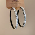 Black Hoop Earrings with White and Black Lettered Edges view 7