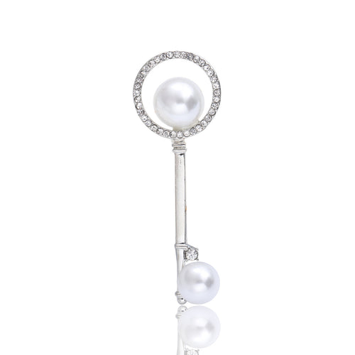 Close-up product view showing the colors and surface details of the pearl and crystal key brooch