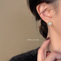 Gold Tone Round Openwork Pearl Stud Earrings With Textured Frame view 3