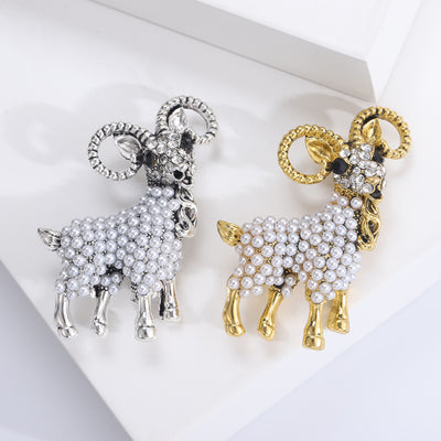 Product display showing a ram with curled crystal horns and a body covered in white pearls