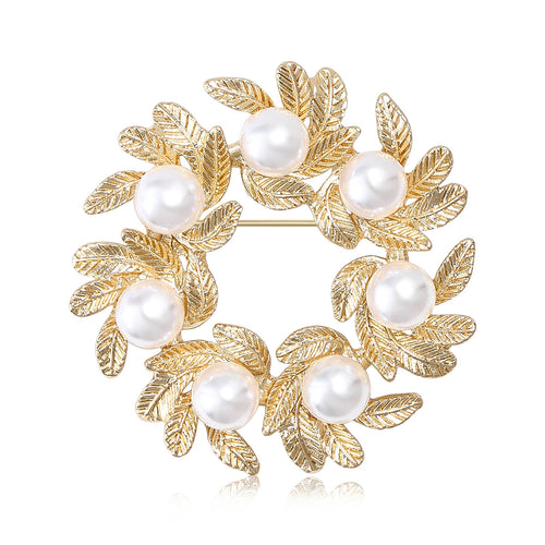 Gold pearl leaf wreath brooch on white