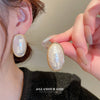 White Oval Studs