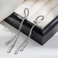 Silver Tone Bow and Double Long Chain Tassel Earrings view 6