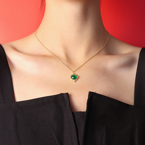 Gold round green agate pendant necklace worn on model