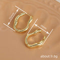 Irregular Wavy Hoop Earrings in Silver and Gold Tones view 4