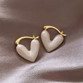 Gold Tone Pink Heart Huggie Earrings with Glossy Enamel Inlays view 1
