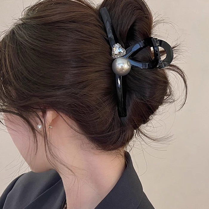 Black Sculptural Loop Hair Claw With Pearl Like Orb And Clear Crystal