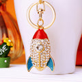 Jeweled Red Rocket Keychain with Blue Fins and Braided Wrist Loop view 4