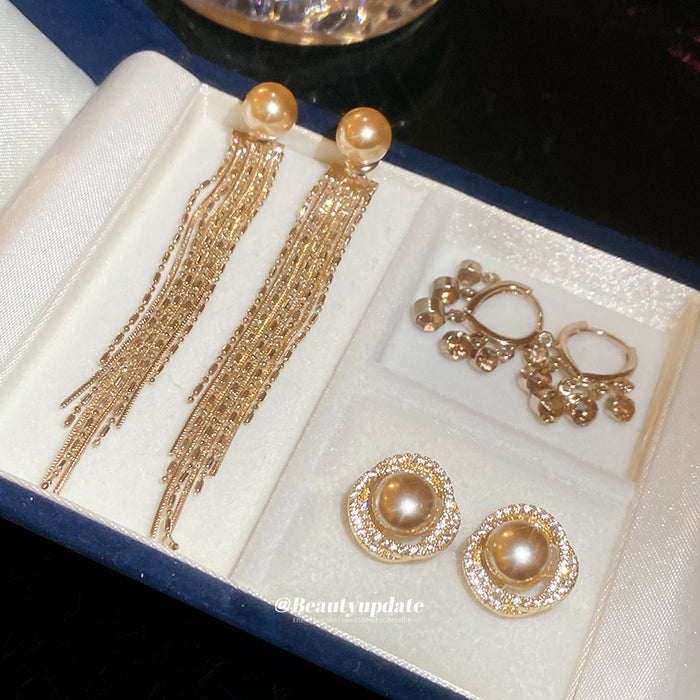 Faux Pearl Hoop And Chain Tassel Earrings With Decorative Metal Details
