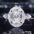 Silver Tone Oval Halo Ring With Clear Side Stones Polished Jewelry view 5