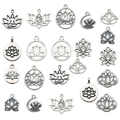 Antique silver assorted shape charms arranged on a light background