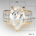 Pear-Shaped Clear Solitaire Wide Band Ring In Gold Tone view 5