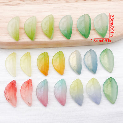 Frosted glass leaf charms with gradient finishes arranged as a full product overview