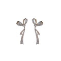 Crystal Bow Tassel Earrings with Asymmetric Silver Tone Drops view 5
