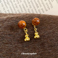 Brown Bead Gourd Drop Stud Earrings With Gold Tone Charms view 2