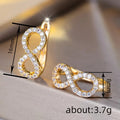 Gold Tone Crystal Pave Infinity Figure Eight Huggie Hoop Earrings view 4